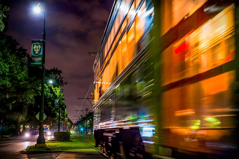 streetcar zooming down st charles at night