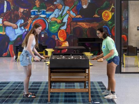 Students playing foosball